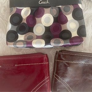 3 coach wristlets for $50. Red leather, brown leather and satin pattern